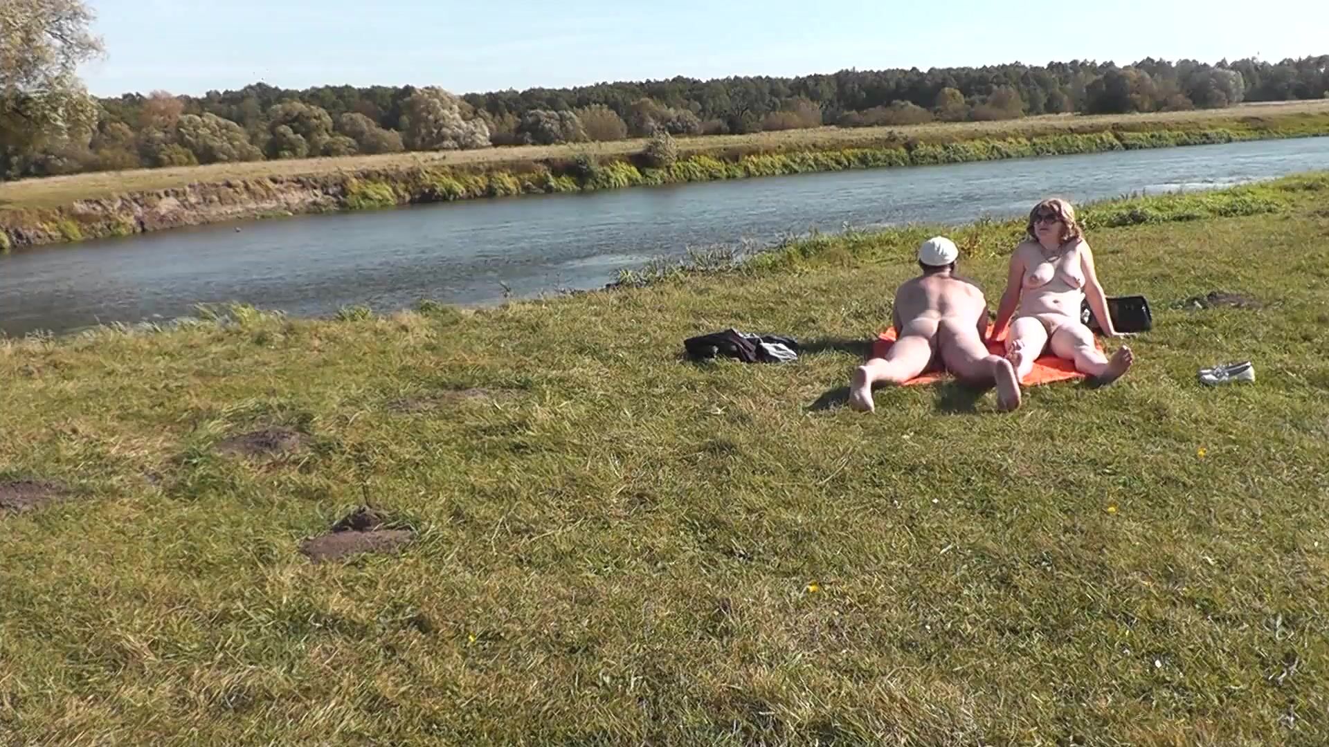 Wild beach. Nudist beach. Outdoors on bank of river lover fucks doggystyle beautiful sexy MILF Frina. Oudoor. Ouside image