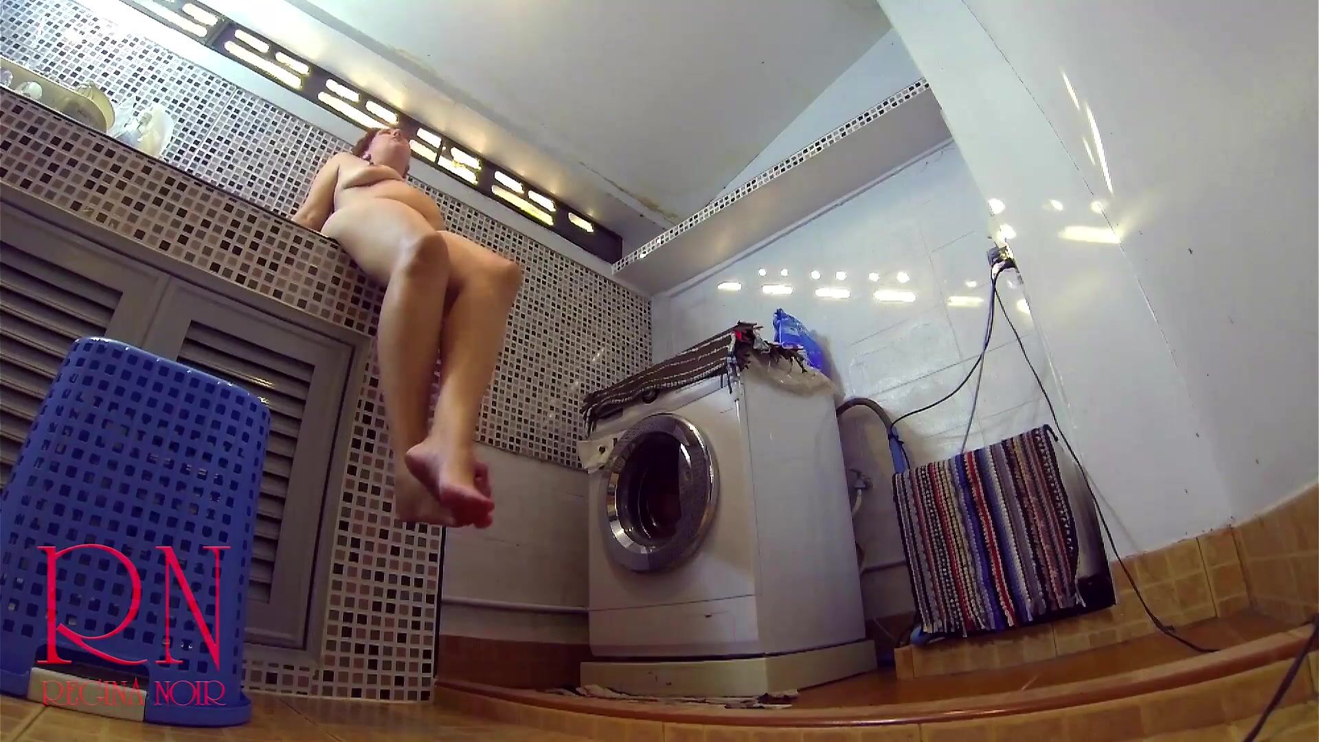 Nudist housekeeper Regina Noir masturbates in laundry. Naked maid
